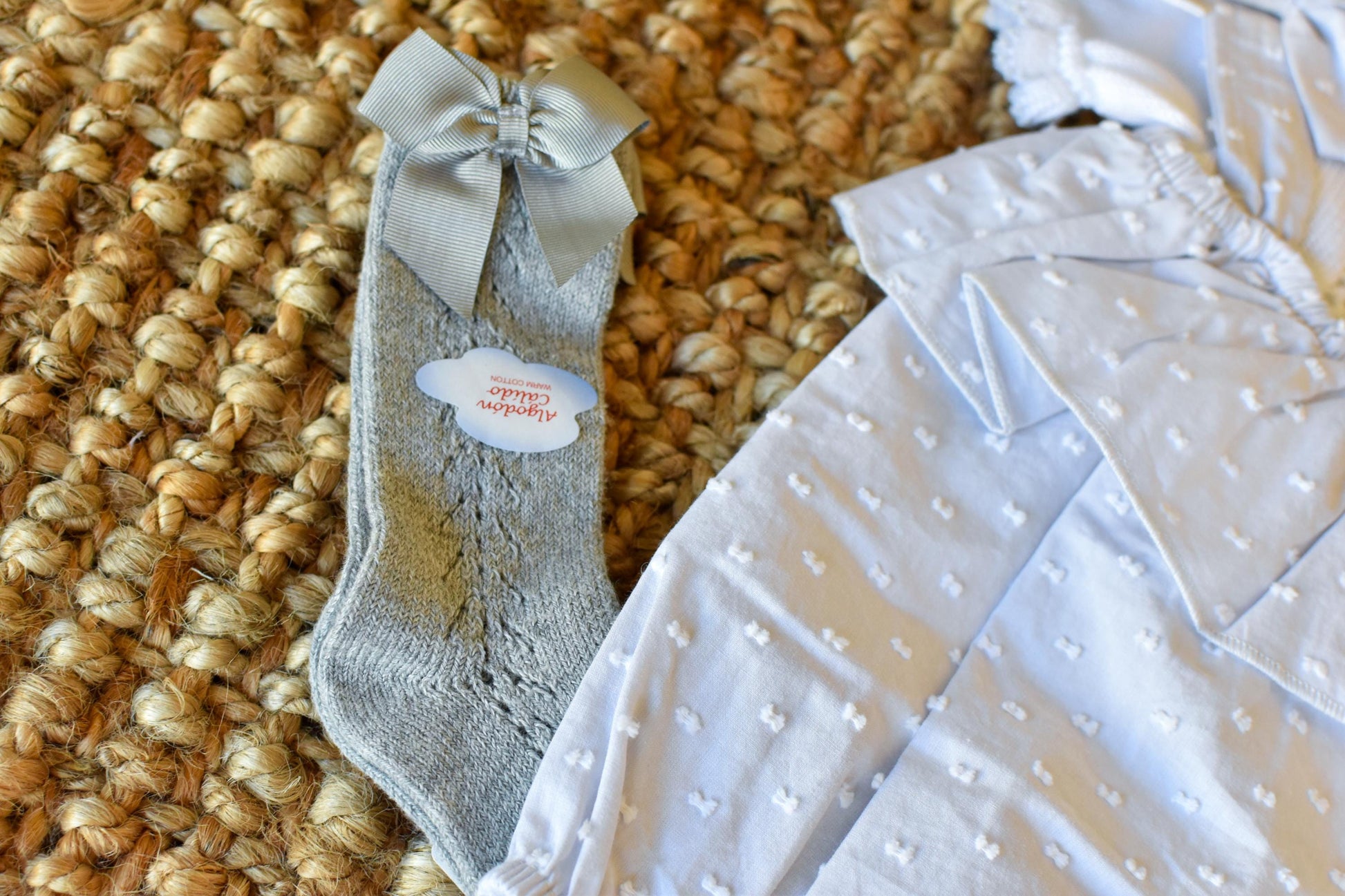 Peto knit with bows and Swiss fabric in Grey