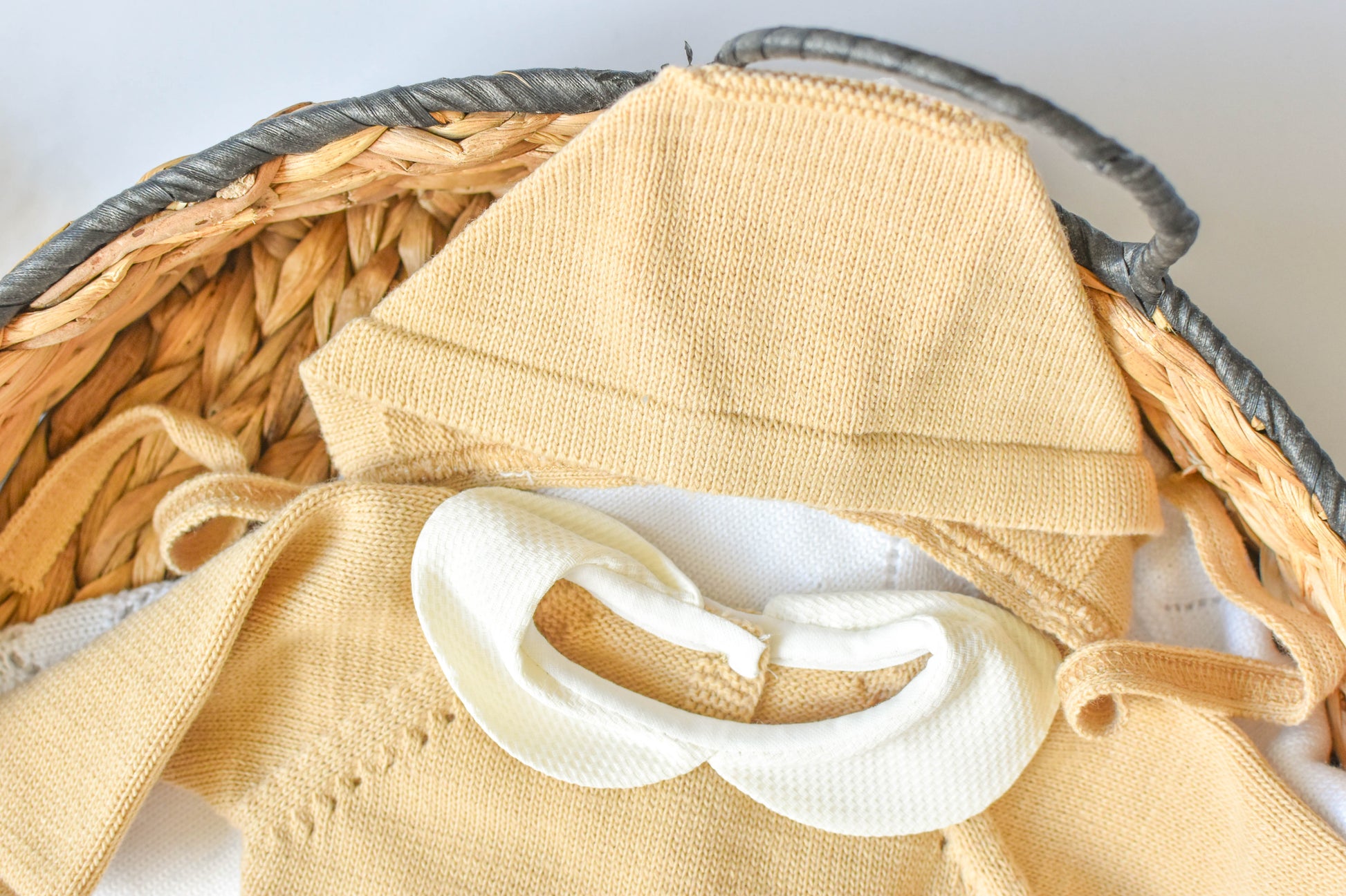 Knitted Pom Pom with lace trim in Camel - White