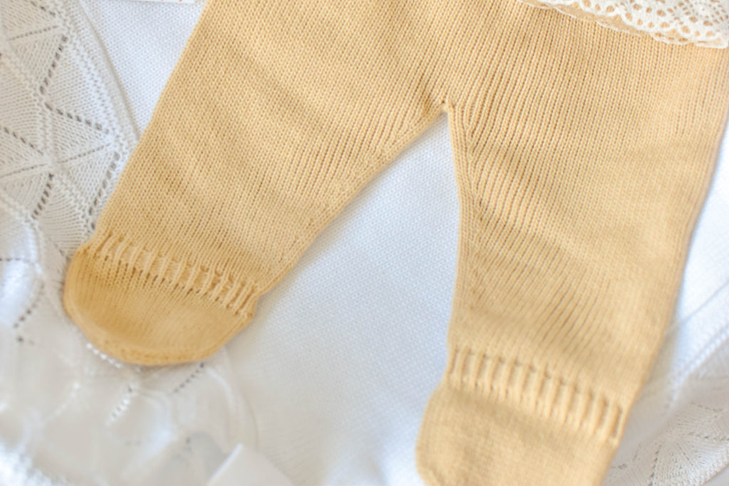 Knitted Pom Pom with lace trim in Camel - White