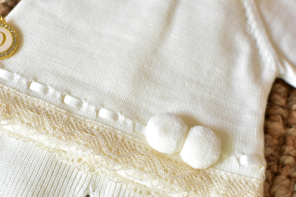 Knitted Pom Pom with lace trim in White - Beige